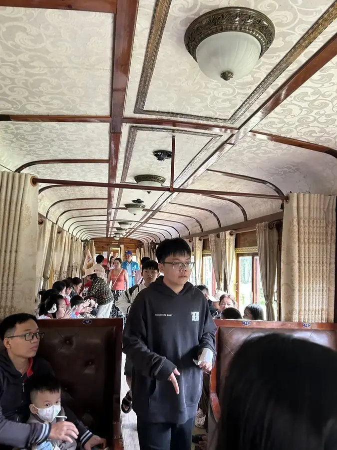 The carriage saloon with a painted ceiling, the Da Lat — Trai Mat train