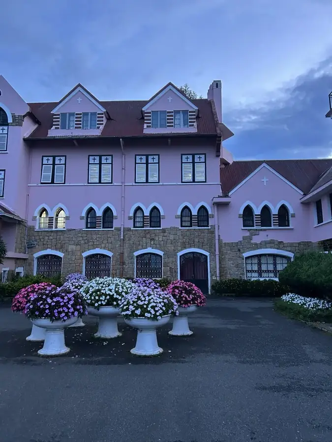 Urns of chrysanthemums by the entrance, Domaine de Marie — Domaine de Marie — the pink church, Đà Lạt