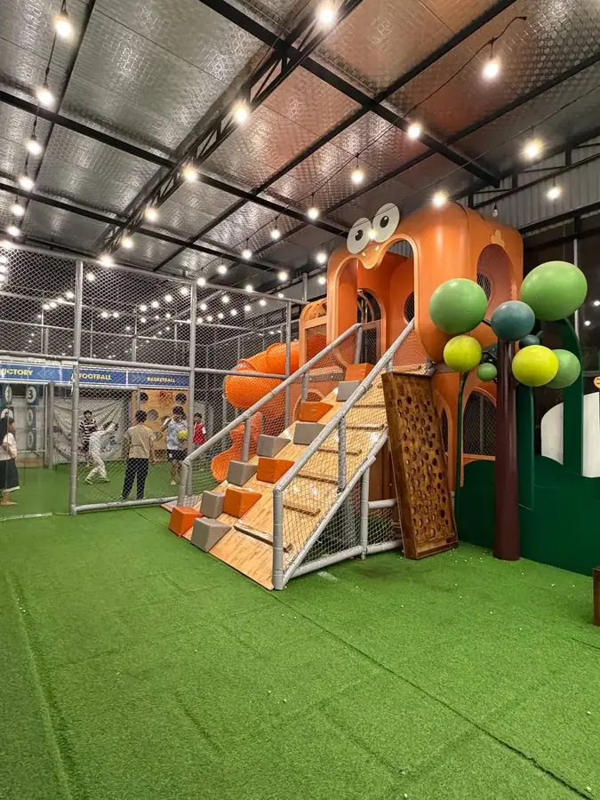 The big slide and the caged pitch at Kids Coffee — Kids Coffee — an indoor play room with a cafe, Da Lat