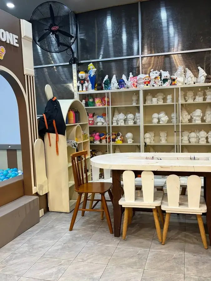 The figurine painting table at Kids Coffee — Kids Coffee — an indoor play room with a cafe, Da Lat