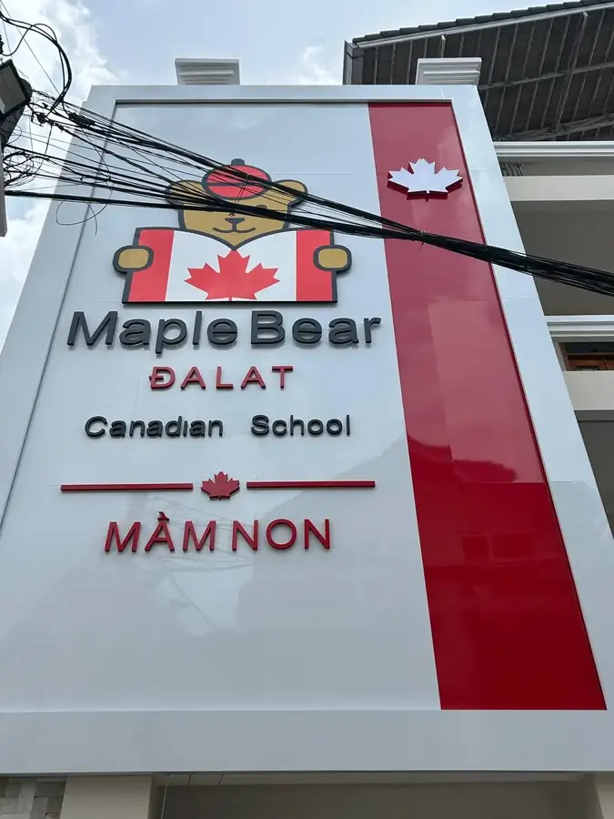 The Maple Bear Da Lat Canadian School sign, "mầm non" meaning preschool