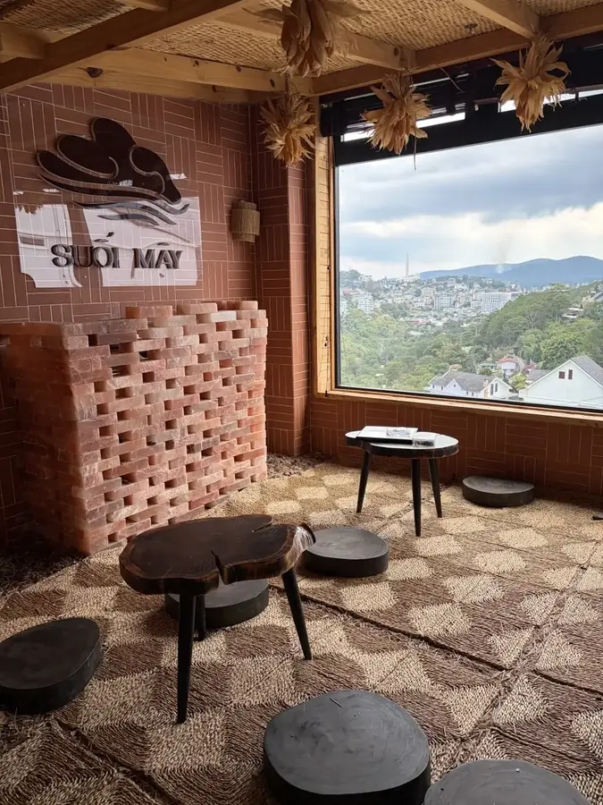 The rest room with a Himalayan salt wall and low tables — Suoi May Onsen & Spa — Japanese baths looking into the pines, Da Lat