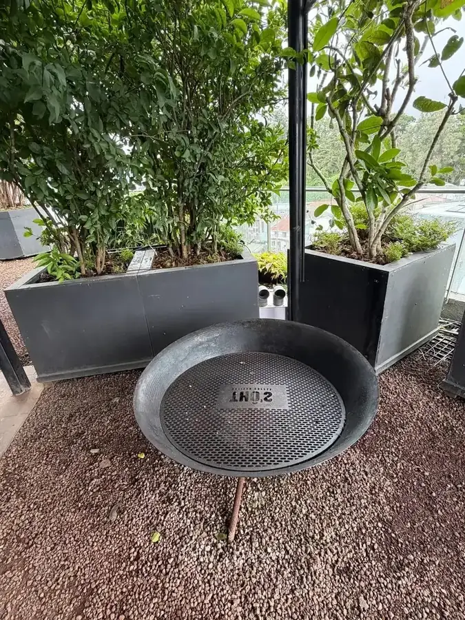 The fire bowl on the Thô’s roof among the planters, Da Lat